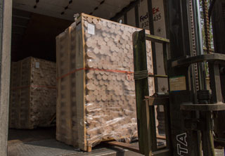 Skid of wood baseball blanks being unloaded